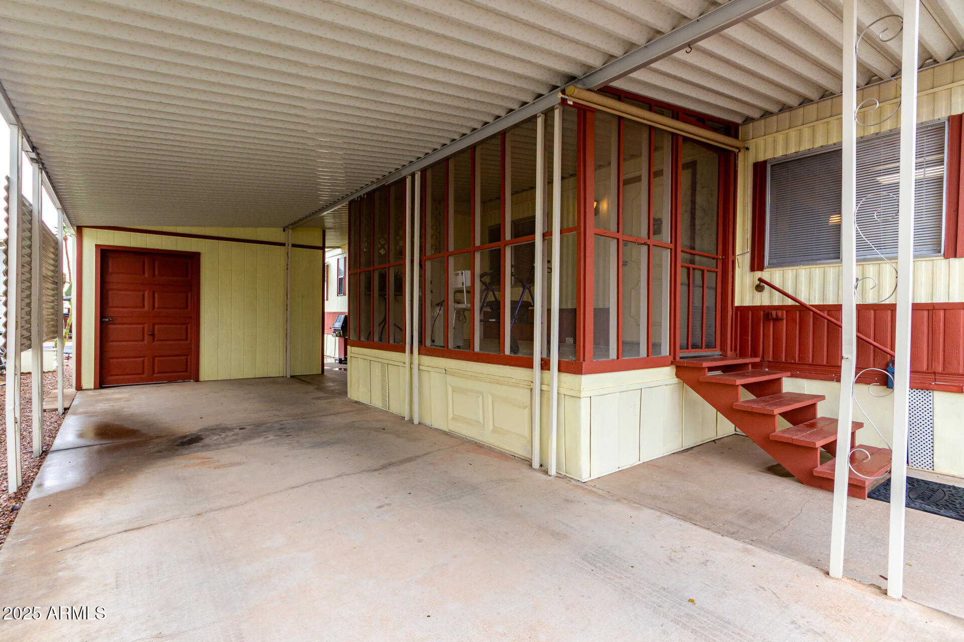 1050 East Broadway Avenue, Unit 84 Apache Junction, AZ 85119 - Photo 3 of 34 a view of an empty room with wooden walls