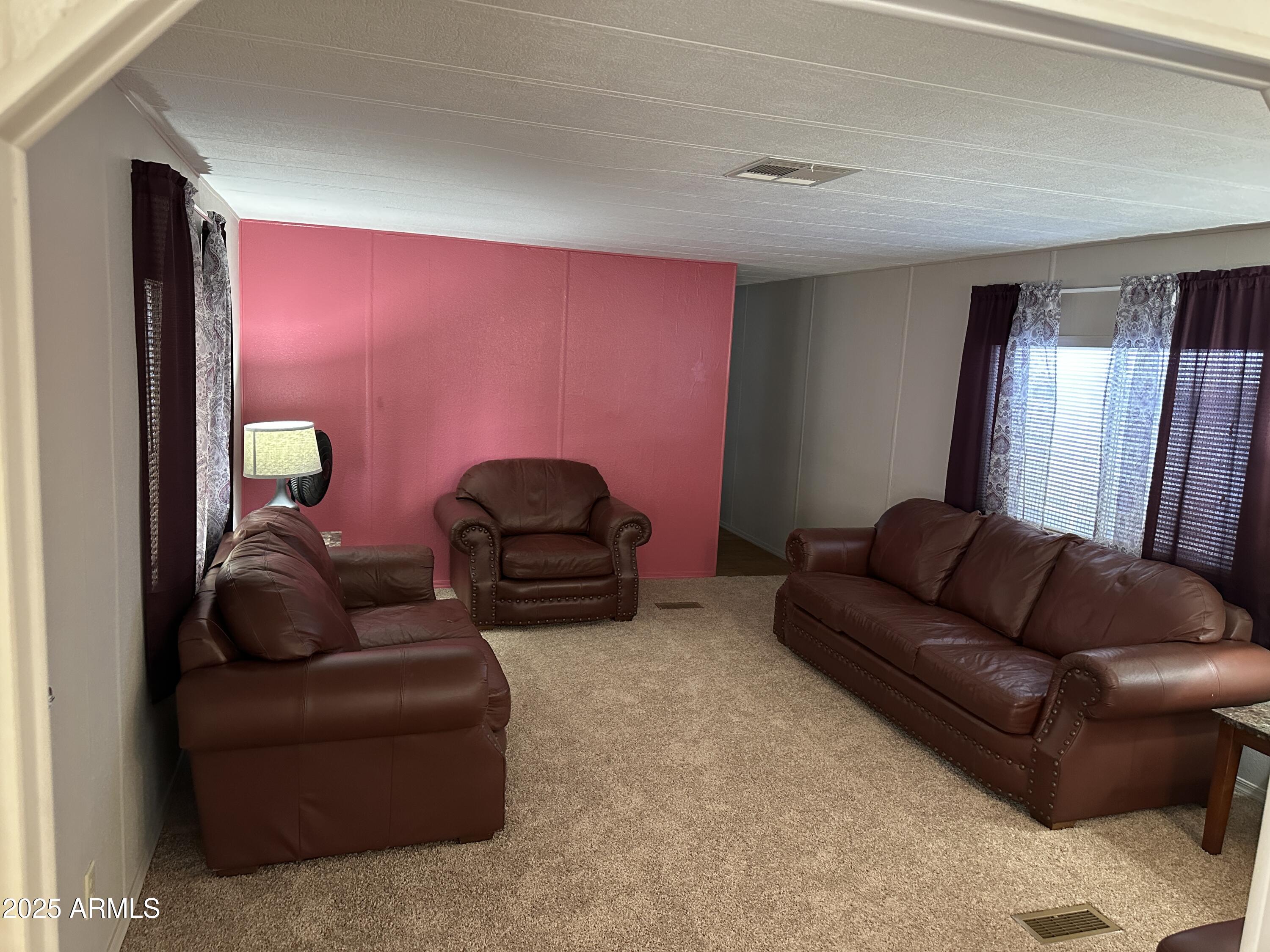 1050 East Broadway Avenue, Unit 84 Apache Junction, AZ 85119 - Photo 6 of 34 a living room with furniture