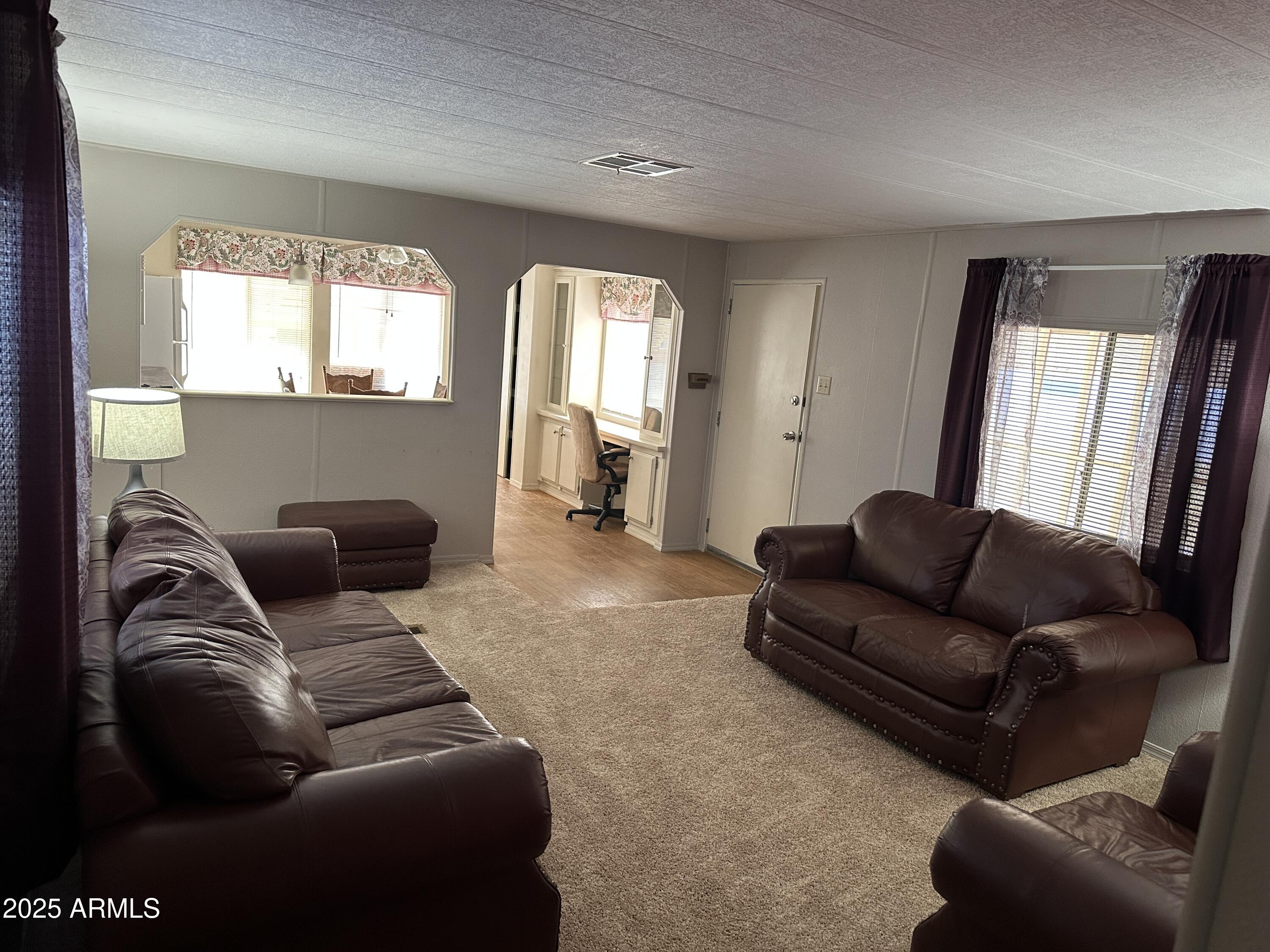 1050 East Broadway Avenue, Unit 84 Apache Junction, AZ 85119 - Photo 7 of 34 a living room with furniture and a couch