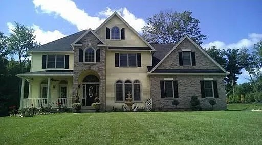 front view of a house with a yard