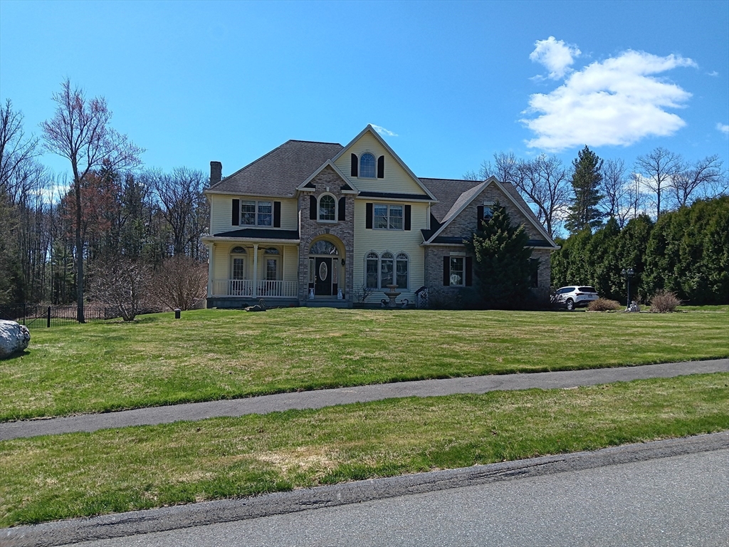 5 Gableview Lane Southwick, MA 01077 - Photo 2 of 31 a front view of a house with a yard
