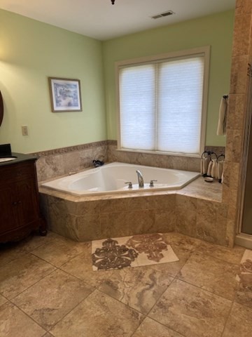 5 Gableview Lane Southwick, MA 01077 - Photo 24 of 31 a bath tub sitting in a bathroom next to a window