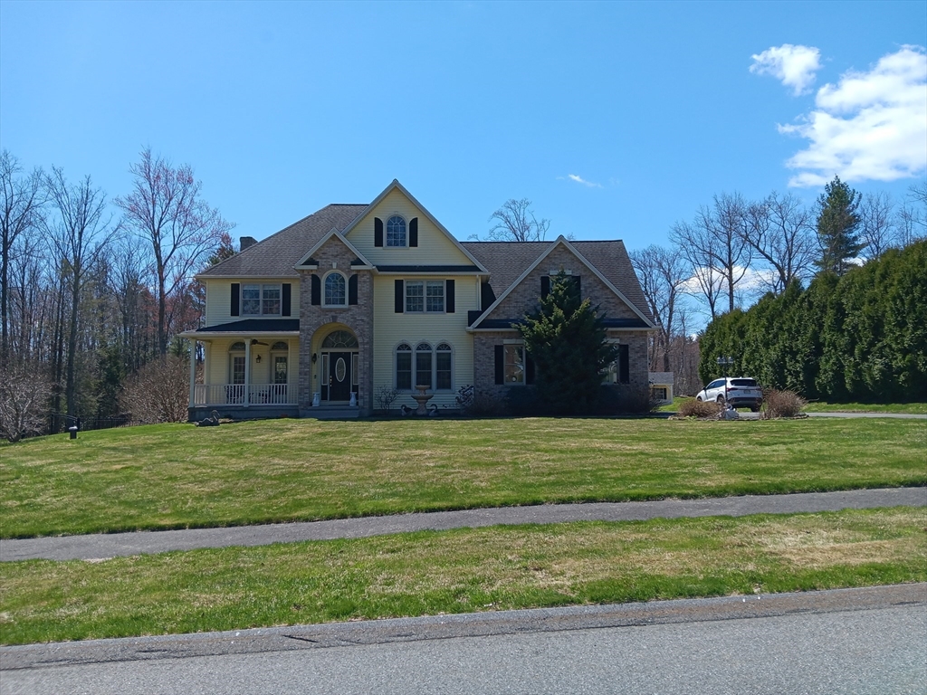 5 Gableview Lane Southwick, MA 01077 - Photo 3 of 31 a front view of a house with a yard