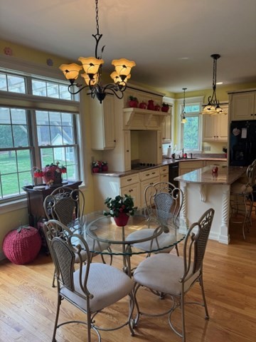 5 Gableview Lane Southwick, MA 01077 - Photo 8 of 31 a dining room filled chandelier and wooden floor