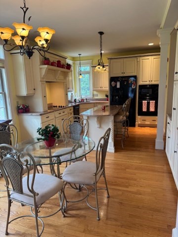 5 Gableview Lane Southwick, MA 01077 - Photo 9 of 31 a view of a dining room with furniture and a chandelier