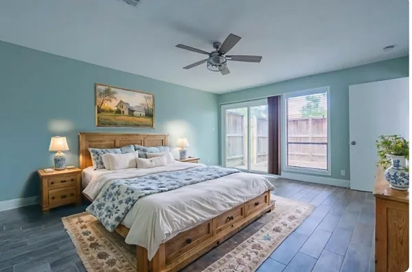 a bedroom with a large bed and a window