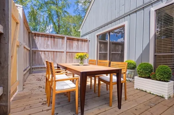 a balcony view with a seating space