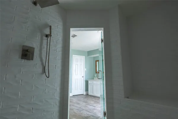 a view of a bathroom from a hallway