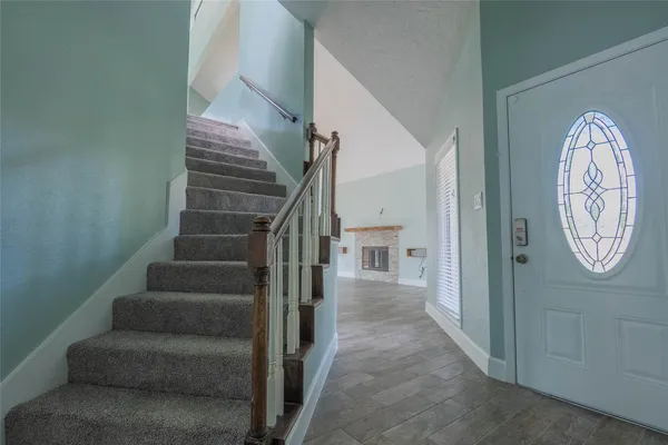 a view of entryway with wooden floor