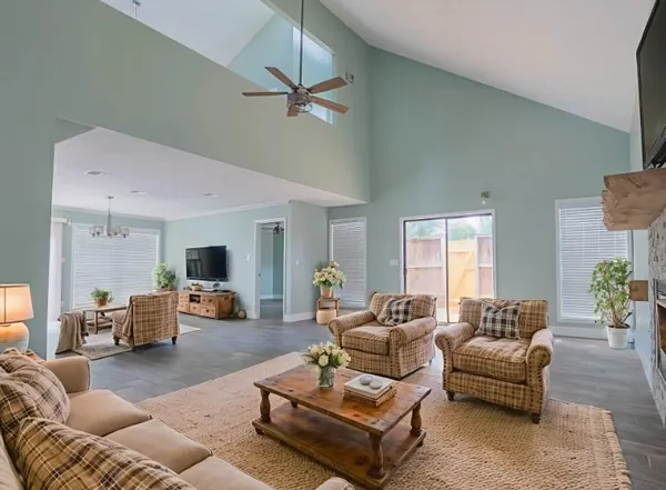 a living room with furniture and a large window
