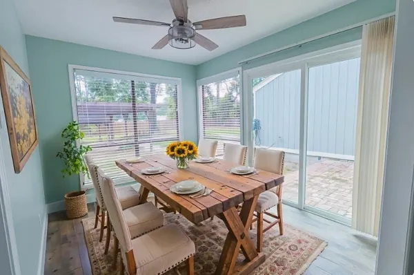 a view of a dining room with furniture window and outside view