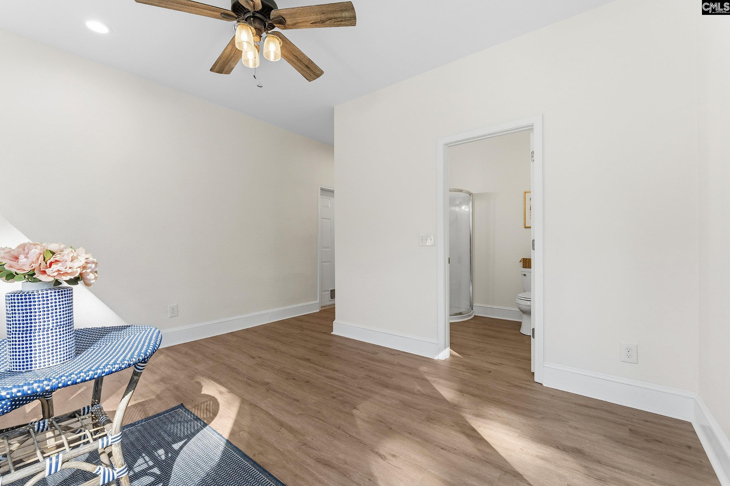 121 Silver Lake Road East Columbia, SC 29223 - Photo 22 of 57 a view of empty room with wooden floor and fan