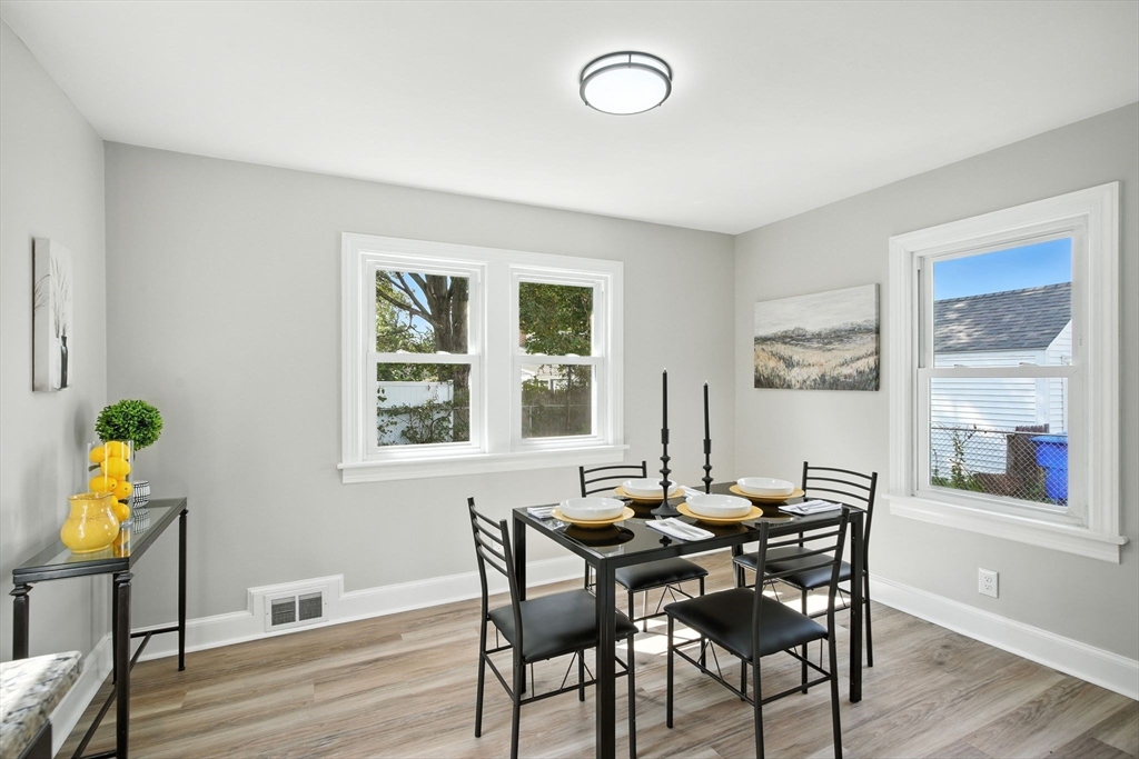 104 Grandview Street Springfield, MA 01118 - Photo 11 of 30 a view of a dining room with furniture and wooden floor