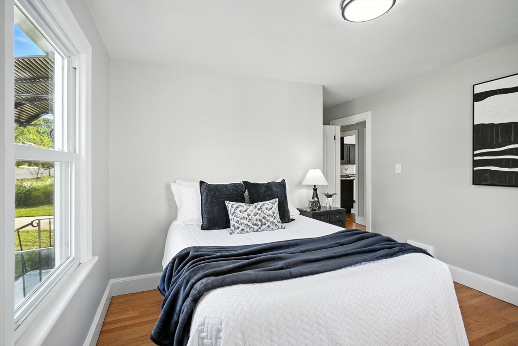 104 Grandview Street Springfield, MA 01118 - Photo 14 of 30 a bedroom with a bed and a window