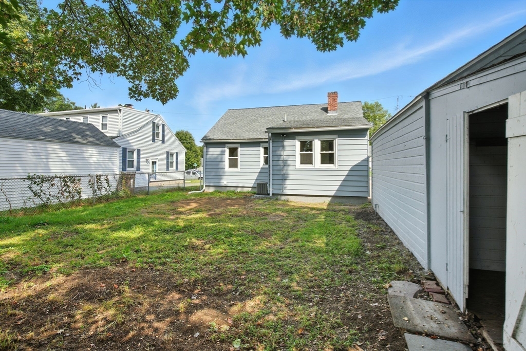 104 Grandview Street Springfield, MA 01118 - Photo 25 of 30 a front view of a house with garden