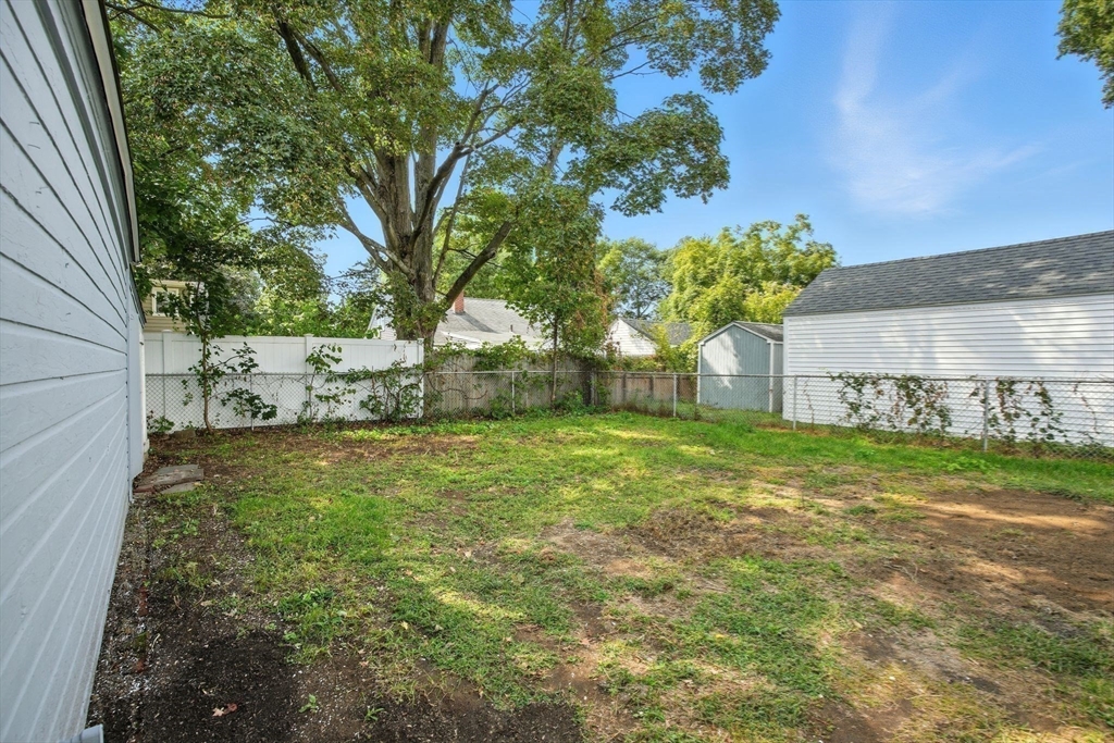 104 Grandview Street Springfield, MA 01118 - Photo 26 of 30 a view of a backyard with large trees