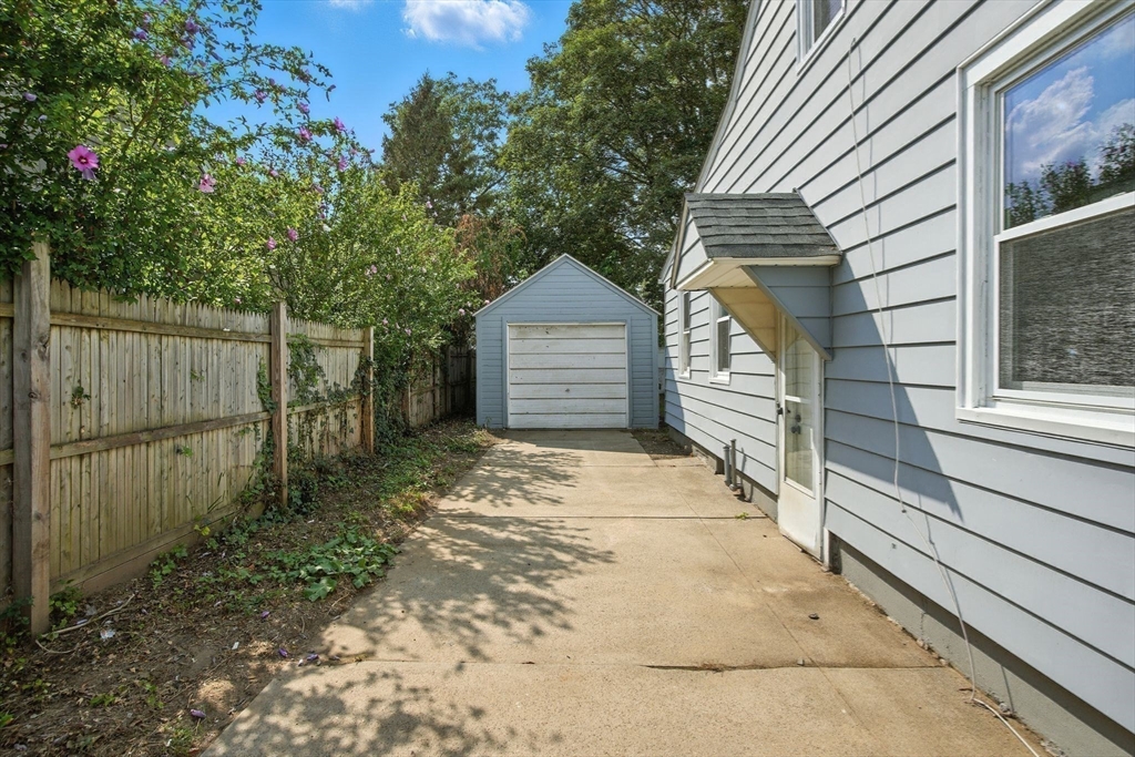 104 Grandview Street Springfield, MA 01118 - Photo 27 of 30 a front view of a house with a garage