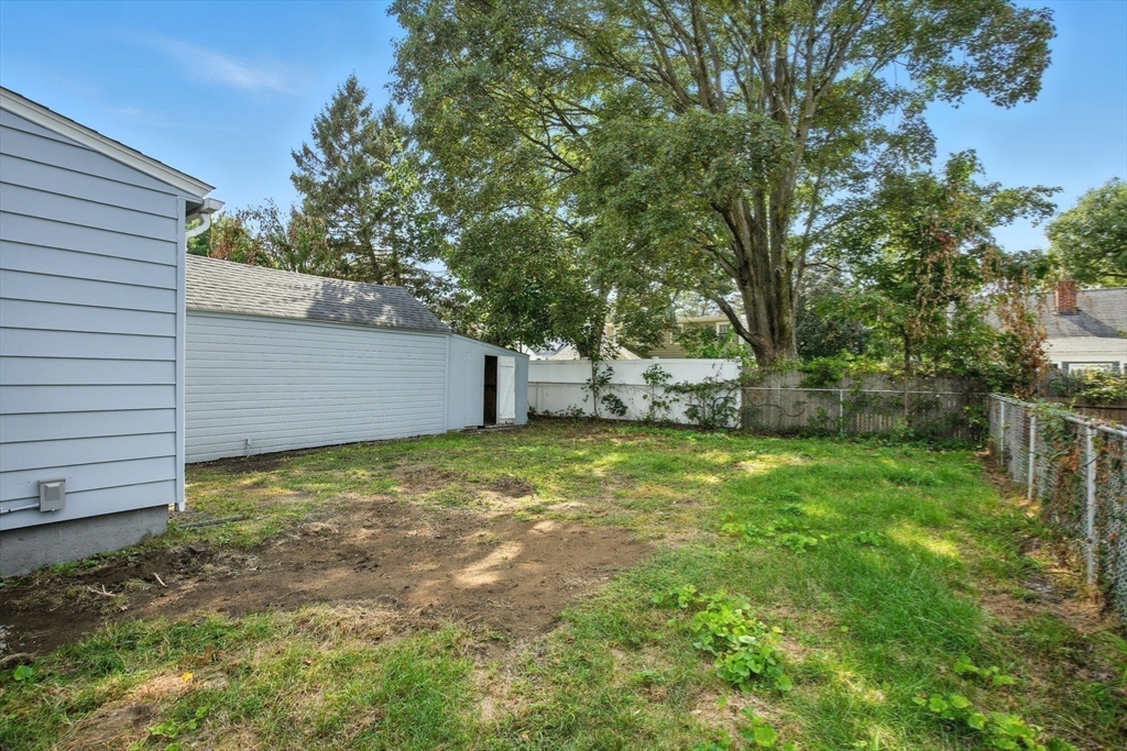 104 Grandview Street Springfield, MA 01118 - Photo 29 of 30 a backyard of a house with table and chairs