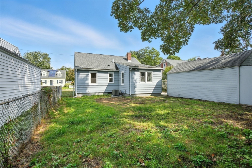 104 Grandview Street Springfield, MA 01118 - Photo 30 of 30 a front view of a house with a yard