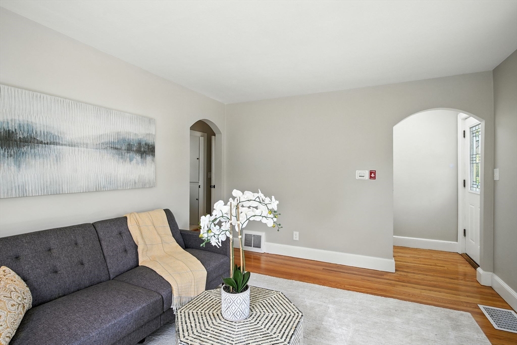 104 Grandview Street Springfield, MA 01118 - Photo 5 of 30 a living room with furniture flowerpot and wooden floor