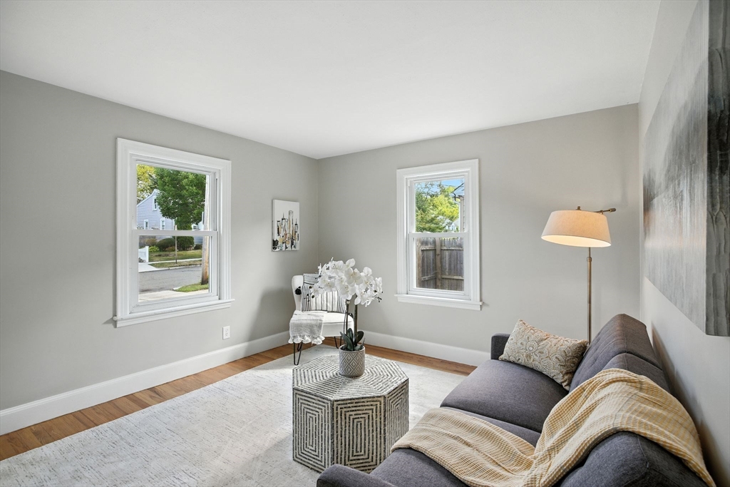 104 Grandview Street Springfield, MA 01118 - Photo 6 of 30 a living room with furniture chess board and a window