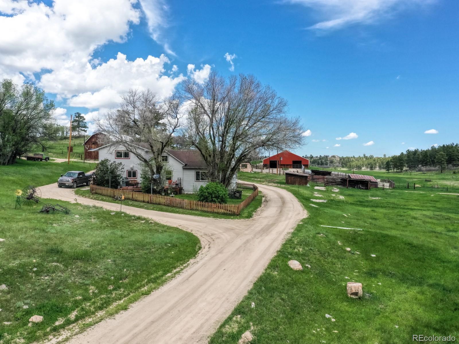 9695 Jones Road Franktown, CO 80116 - Photo 27 of 40 a view of a park with large trees