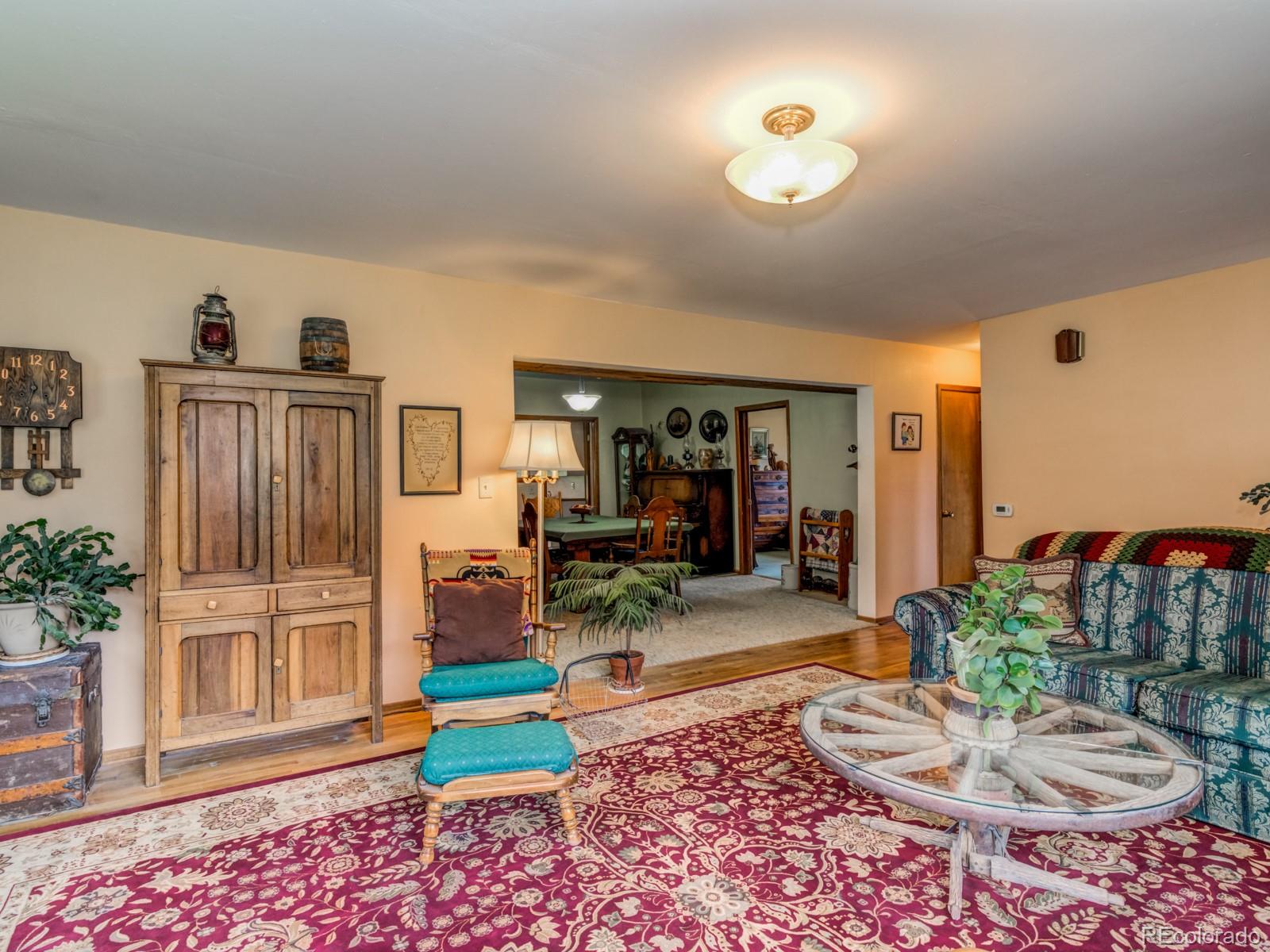 9695 Jones Road Franktown, CO 80116 - Photo 7 of 40 a living room with furniture