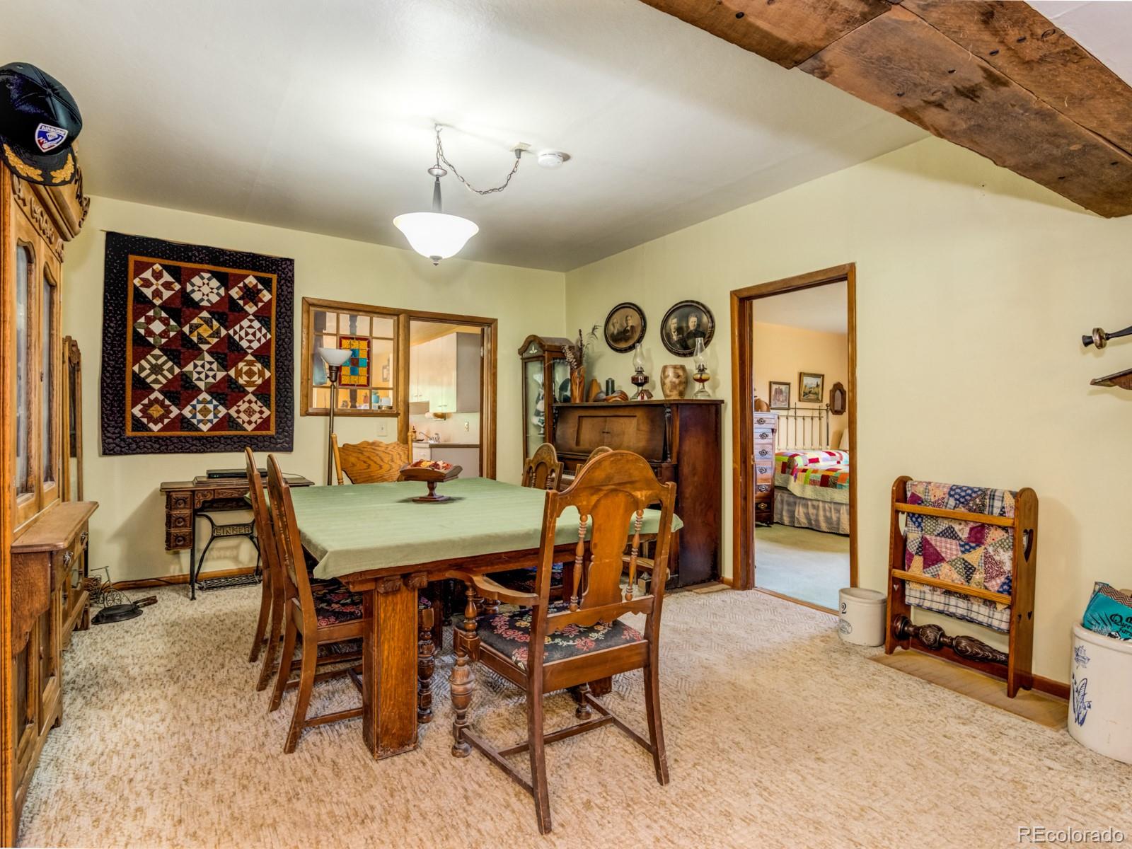 9695 Jones Road Franktown, CO 80116 - Photo 9 of 40 a view of a dining room with furniture and chandelier
