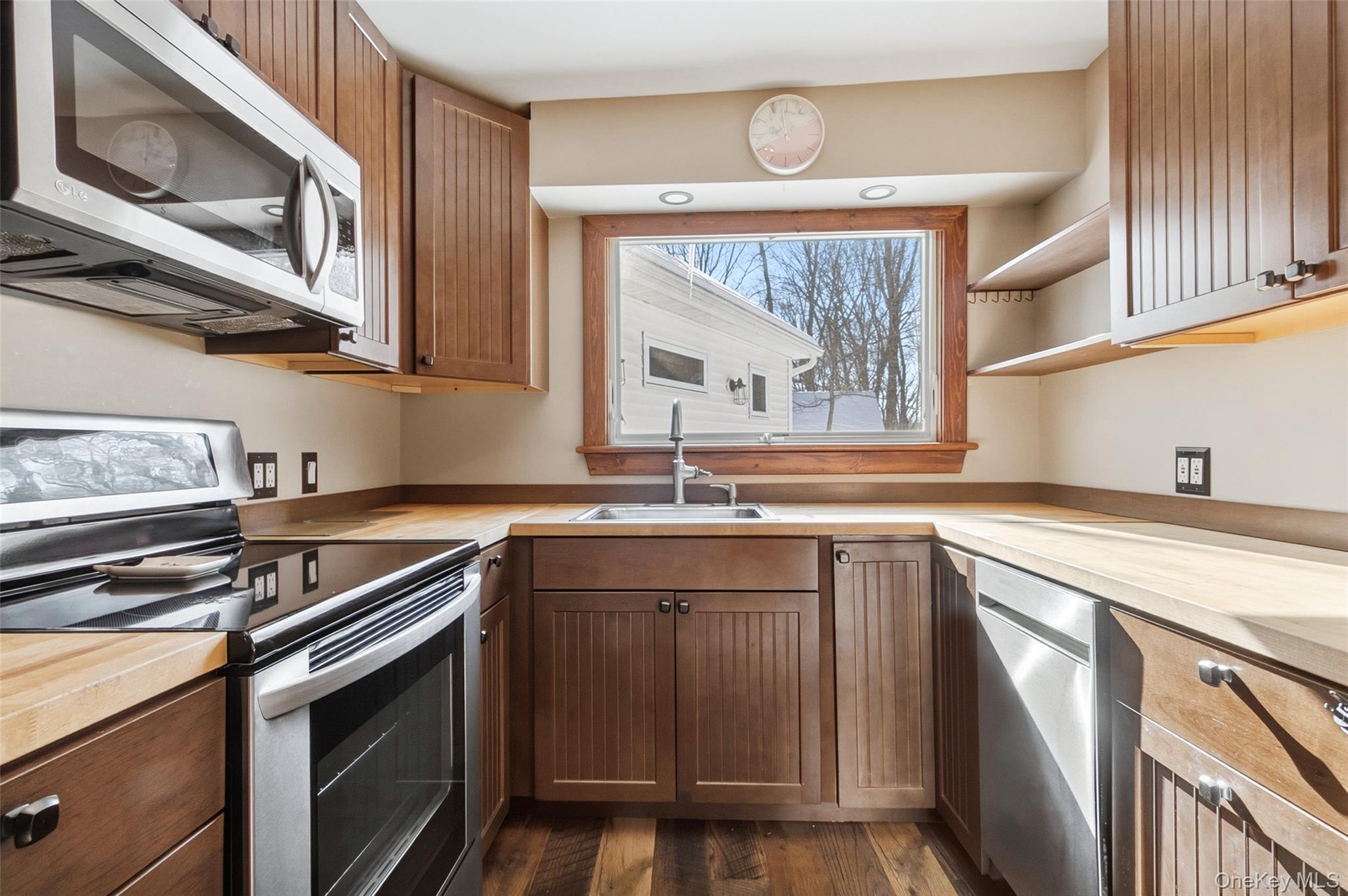 19 Curry Road Mahopac, NY 10541 - Photo 11 of 36 a kitchen with stainless steel appliances a sink stove and cabinets