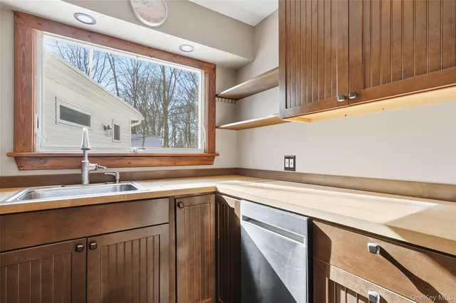 a kitchen with a sink and a window