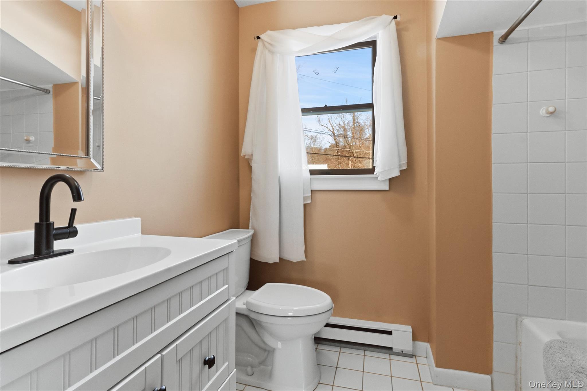 19 Curry Road Mahopac, NY 10541 - Photo 17 of 36 a bathroom with a toilet sink and mirror