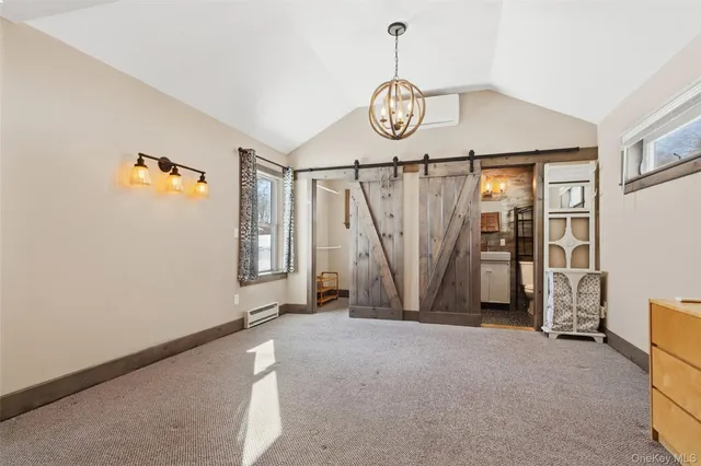 a view of an empty room with a fan