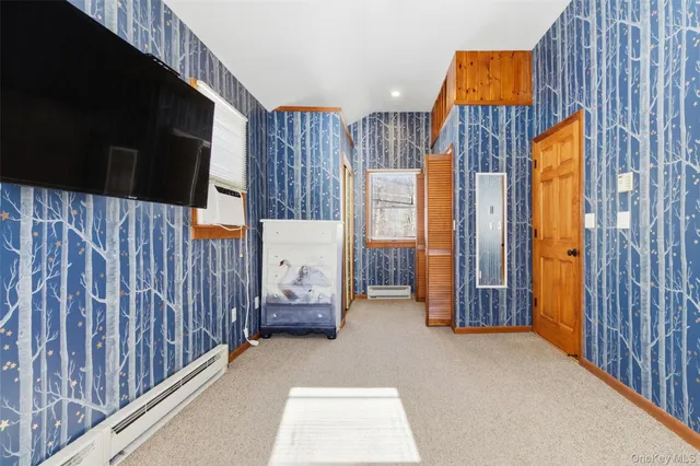 a view of front door and bedroom from a balcony