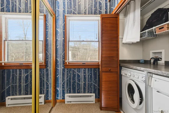 a view of a kitchen with washer and dryer