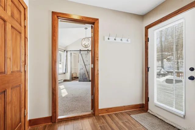 an empty room and wooden door