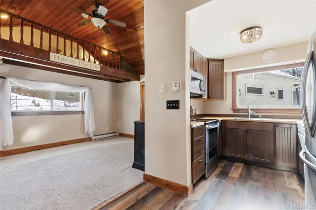 a kitchen with stainless steel appliances granite countertop a stove and a refrigerator