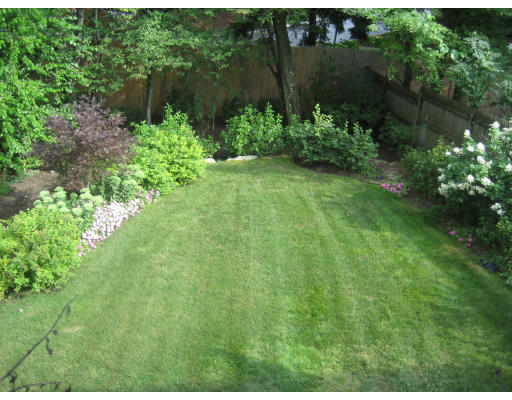 32 Tanglewood Road, Unit 32 Newton, MA 02459 - Photo 2 of 3 a view of a garden with a lake