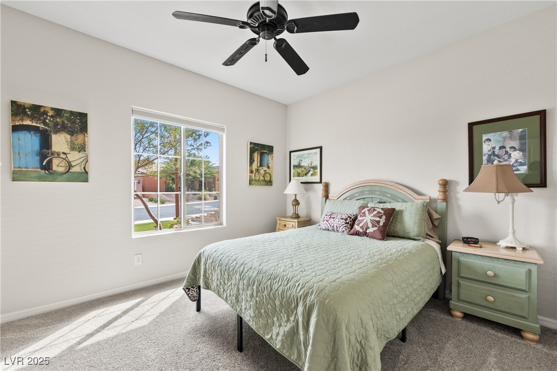 1221 Tortoise Ridge Mesquite, NV 89034 - Photo 11 of 56 Bedroom featuring carpet floors and a ceiling fan