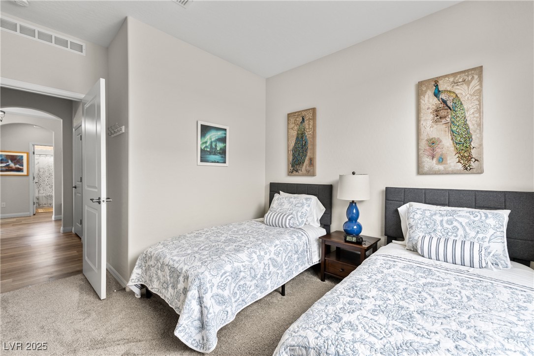1221 Tortoise Ridge Mesquite, NV 89034 - Photo 15 of 56 Carpeted bedroom with arched walkways and baseboards