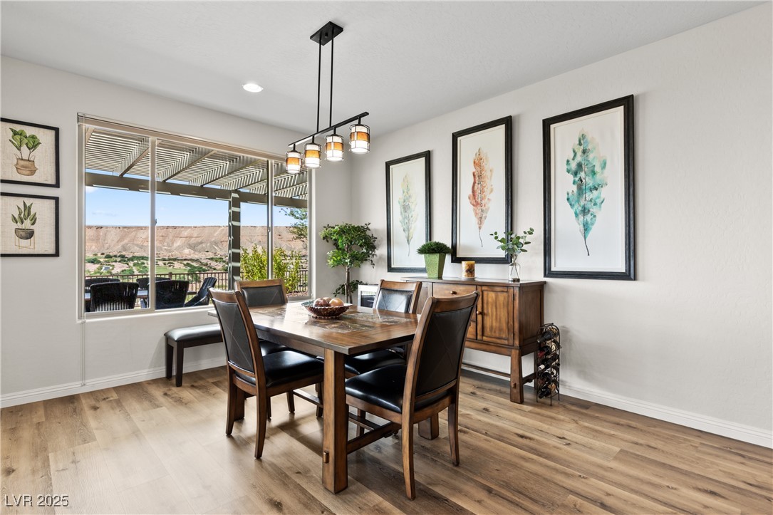 1221 Tortoise Ridge Mesquite, NV 89034 - Photo 19 of 56 Dining room with light wood finished floors, a mountain view, and recessed lighting