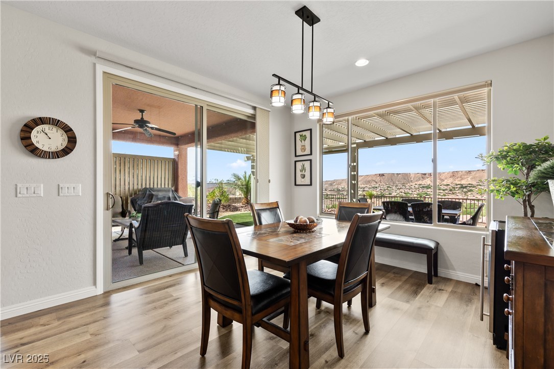 1221 Tortoise Ridge Mesquite, NV 89034 - Photo 20 of 56 Dining room featuring light wood-style flooring, healthy amount of natural light, a ceiling fan, and recessed lighting