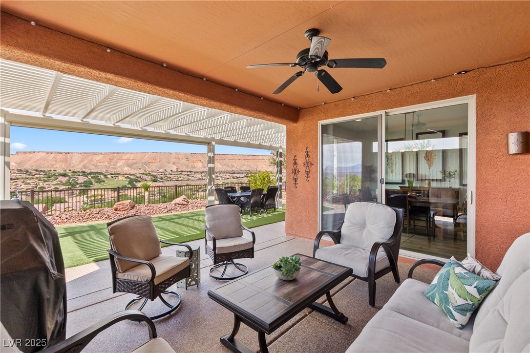 1221 Tortoise Ridge Mesquite, NV 89034 - Photo 35 of 56 View of patio / terrace with a pergola, area for grilling, a ceiling fan, and outdoor lounge area