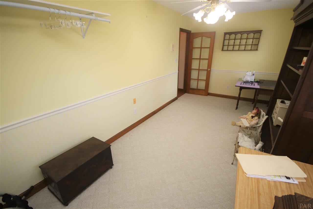 5017 Roland Road Pace, FL 32571 - Photo 34 of 50 the hallway at the top of the stairs.