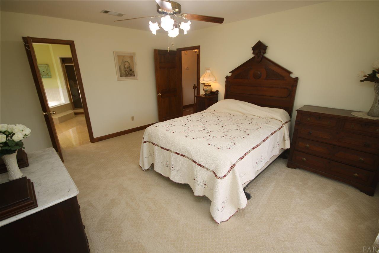 5017 Roland Road Pace, FL 32571 - Photo 36 of 50 carpet 2019. Door to the left - master bath.
