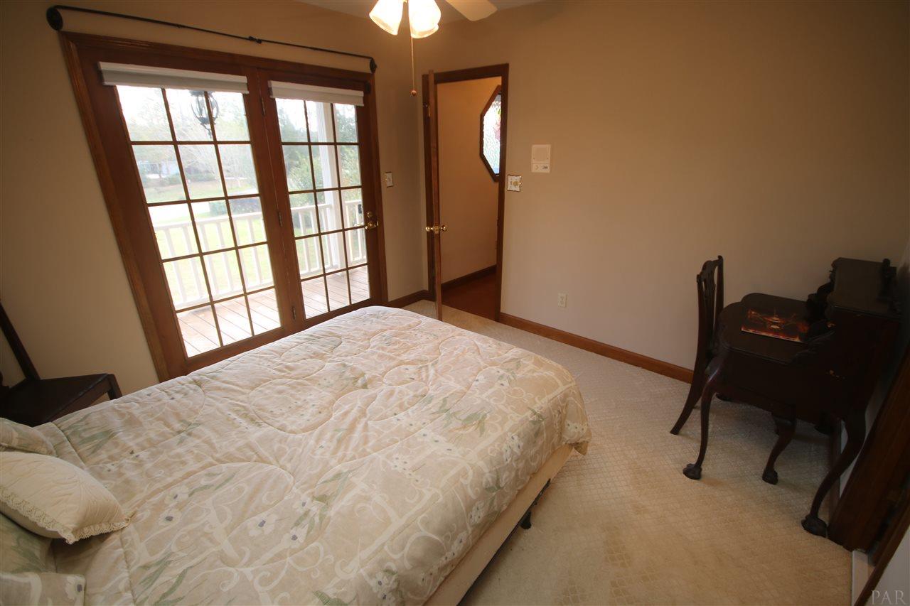 5017 Roland Road Pace, FL 32571 - Photo 41 of 50 5 x 31' balcony. Doors w/ pull down shades.