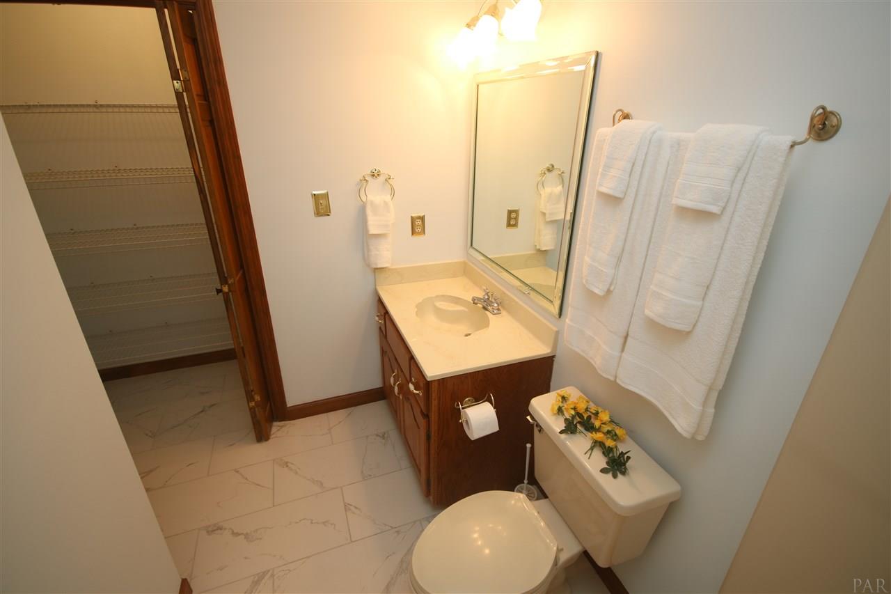 5017 Roland Road Pace, FL 32571 - Photo 42 of 50 tile flooring & large closet with a light.
