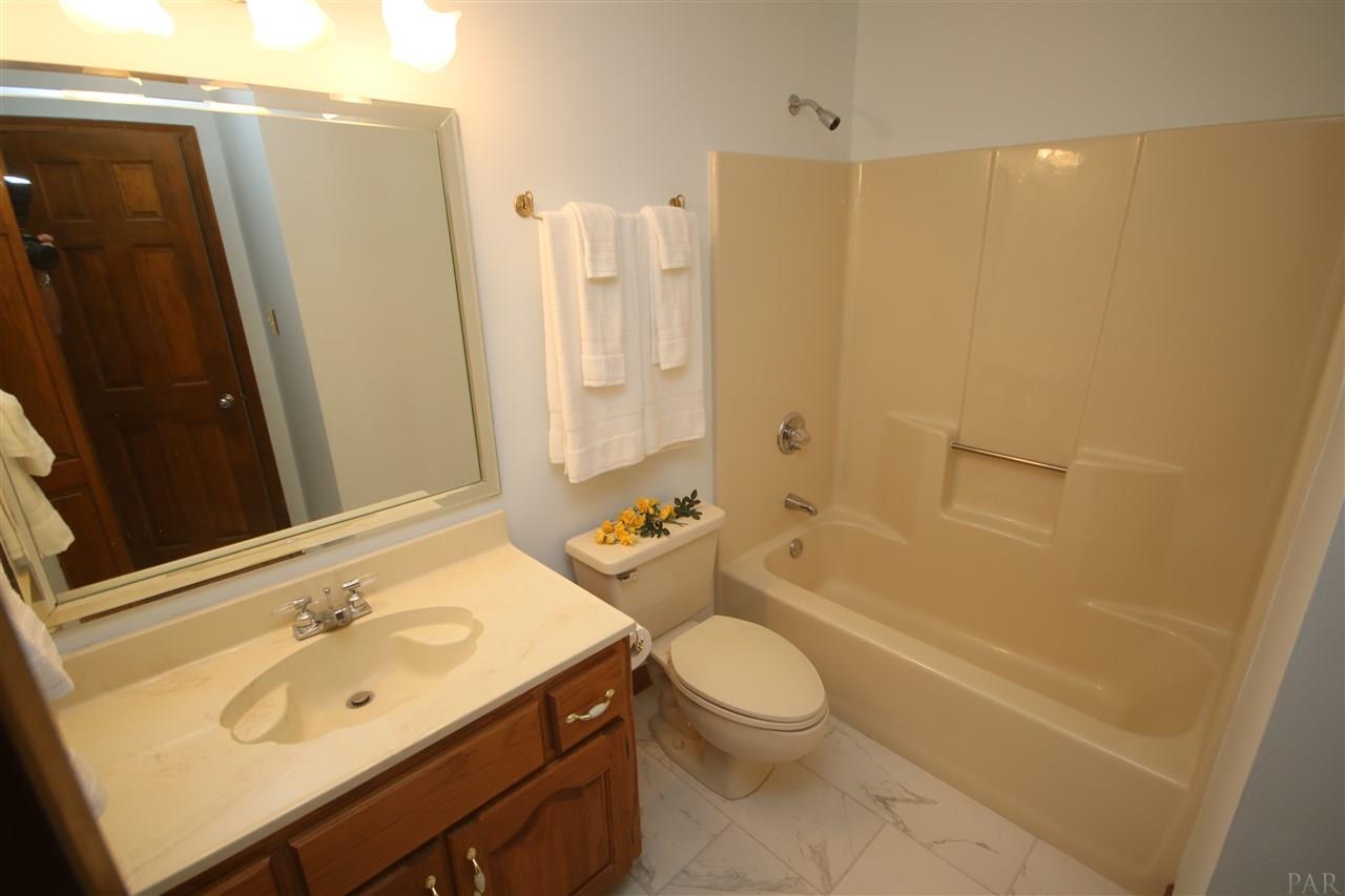 5017 Roland Road Pace, FL 32571 - Photo 43 of 50 top. Elongated toilet.