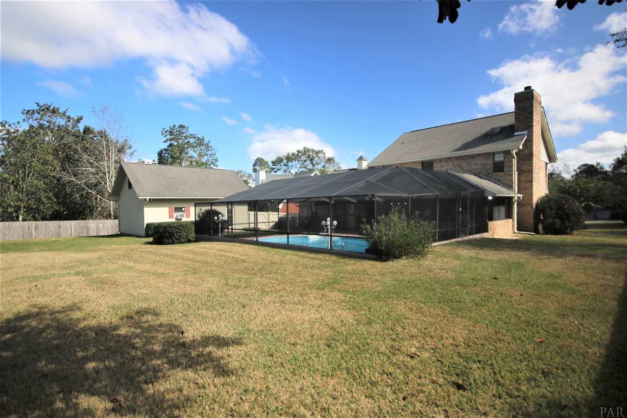 5017 Roland Road Pace, FL 32571 - Photo 47 of 50 doors. Kidney shaped pool w/ light.