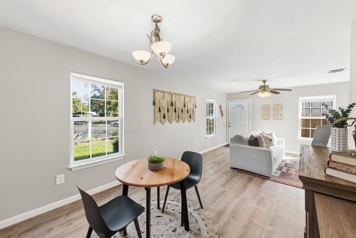 4615 Munson Street Austin, TX 78721 - Photo 12 of 27 Dining space with healthy amount of natural light, light wood finished floors, and a ceiling fan