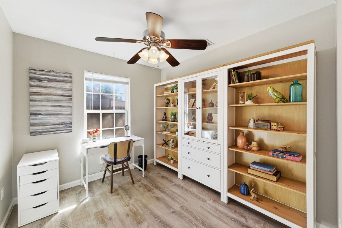 4615 Munson Street Austin, TX 78721 - Photo 20 of 27 Home office featuring light wood-style floors and ceiling fan